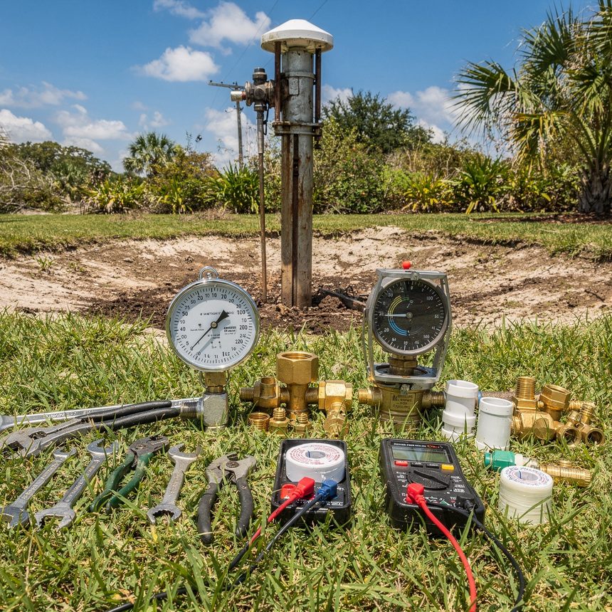 Well pump technician servicing a pressure tank in Ocala, FL